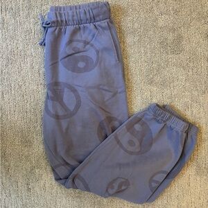 Pacsun purple drawstring sweatpant joggers with peace, sign, and yin yang design